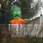 Franky_Cropped A blow up Frankenstein monster in a back yard.